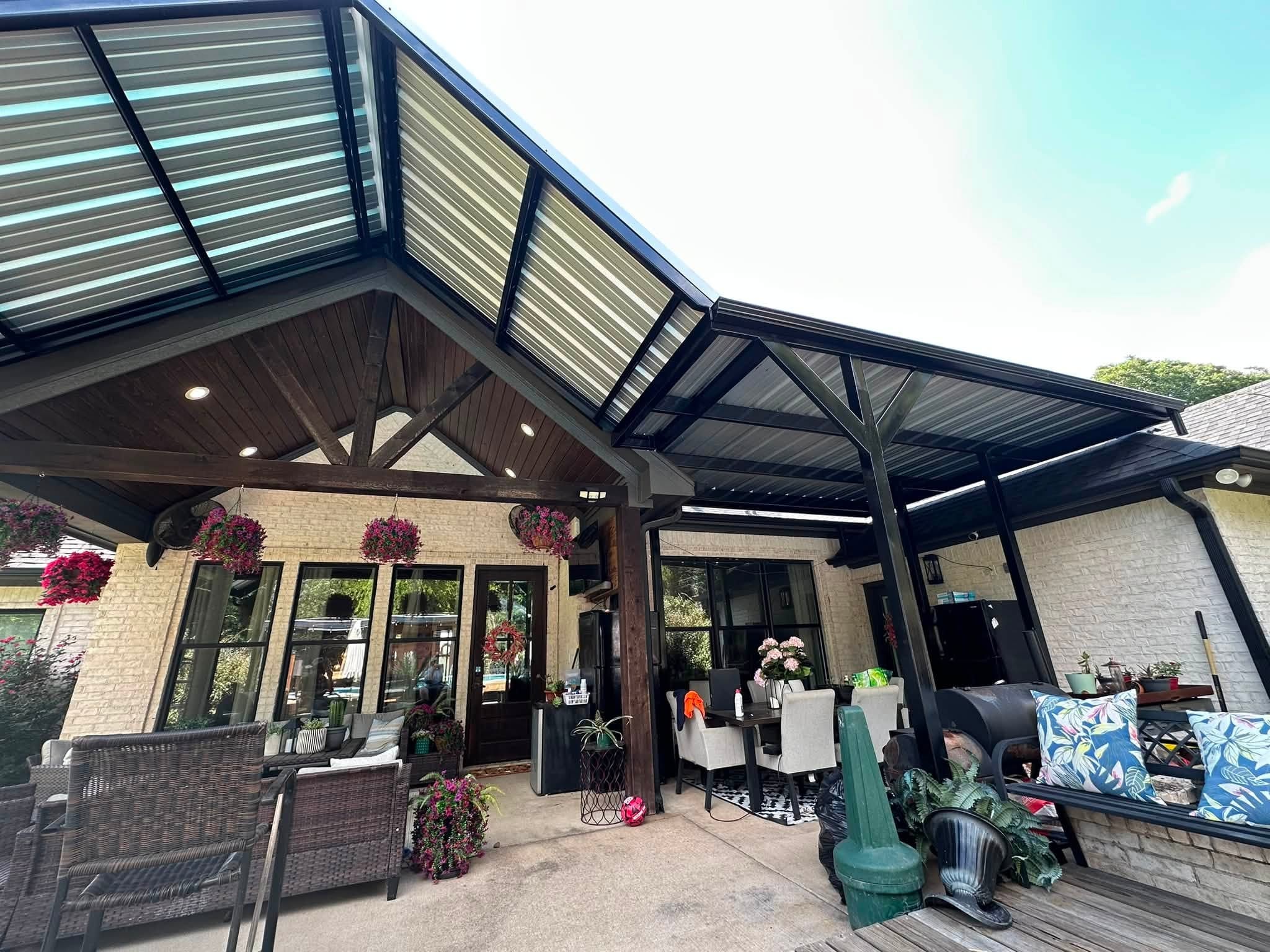 Custom gable patio cover with metal roof and outdoor living space
